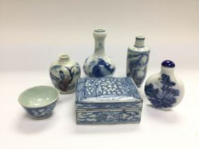 Six small blue and white ceramic items comprising