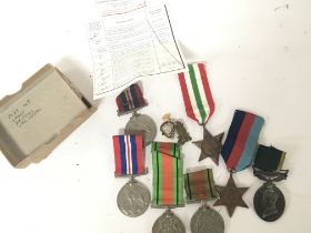 A collection of II world war medals including an E