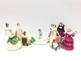 A collection of Royal Doulton and Coalport figurin