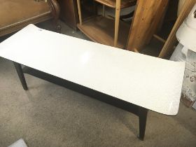 A 1960s design coffee table with a shaped rectangu