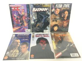 A collection of comic books including Marvel, DC,