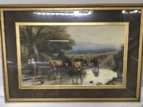A framed print rural scene with dairy cows crossing a river in a gilt frame the reverse with applied