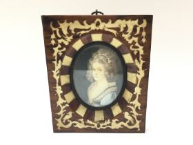 A framed and inlaid decorated miniature, dimension