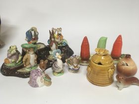 A collection of Beatrix potter Beswick figures wit