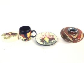 A collection of three Moorcroft items and an art s