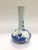 A blue and white squat shaped vase with elongated