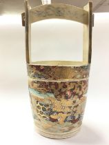 A Japanese satsuma bucket vase, decorated with fig