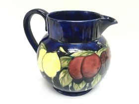 A Moorcroft jug. 17cm tall.