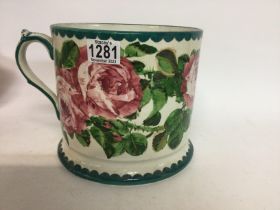 A large Wemyss ware tankard decorated in cabbage r