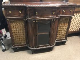 A Regency rose wood side cabinet fitted with three