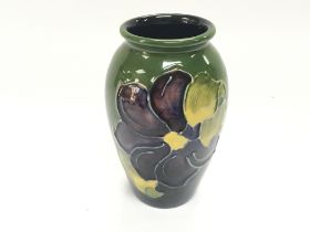 A small Moorcroft vase 10.5cm tall. Good condition