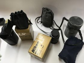 A collection of Nikon lens 135mm cl-33 and three o