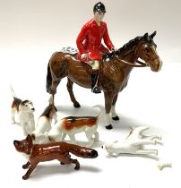 A Beswick Huntsman and dogs with fox. (1 dog A/F,