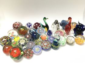 A collection of various paperweights including Strathearn, Perthshire and art glass figures. Postage