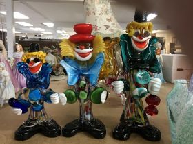 A collection of glass including three Murno clowns