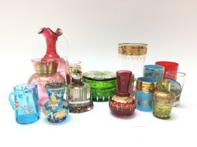 A collection of coloured decorated miniature glass