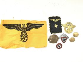 A collection of Third Reich badges including political badge, German State Service arm band and