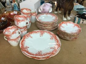 A foley red and white tea set decorated with flowe