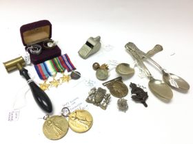 A collection of WW1 and WW2 items including a vict