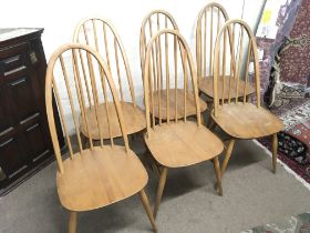 A set of six Ercol chairs, 98cm tall, 42cm wide. P