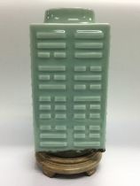 A squared form Celadon vase with raised decoration