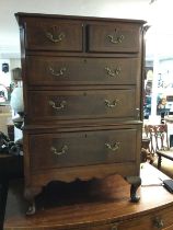 A small mahogany chest of drawers fitted with two