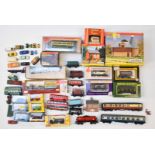 A collection of 00 gauge model railway rolling stock items, buildings and cars including