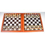 Two chess sets with fantasy Dungeons and Dragons style pieces, both with boards.