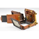 19th or early 20thC mahogany plate camera with shutter and lens, together with two film holders