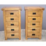 A pair of contemporary solid oak chests of five drawers with black drop handles, W57 x D42 x H101cm