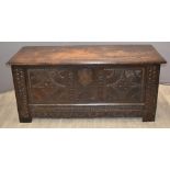 18thC large carved oak coffer with shell decoration and shield shaped lock plates, raised on