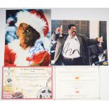 Two autographed film or movie photographs comprising Jim Carrey and Eddie Murphy, each 20 x 25cm