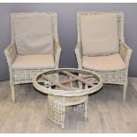 Two Bramblecrest reclining garden chairs and a circular table