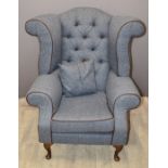 Wing back armchair with button back and cushion, raised on cabriole legs, recently upholstered in