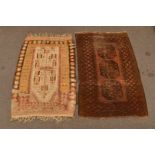 A hanging wool rug, probably Caucases, 170 x 106cm, together with a Turkoman rug with three guls,