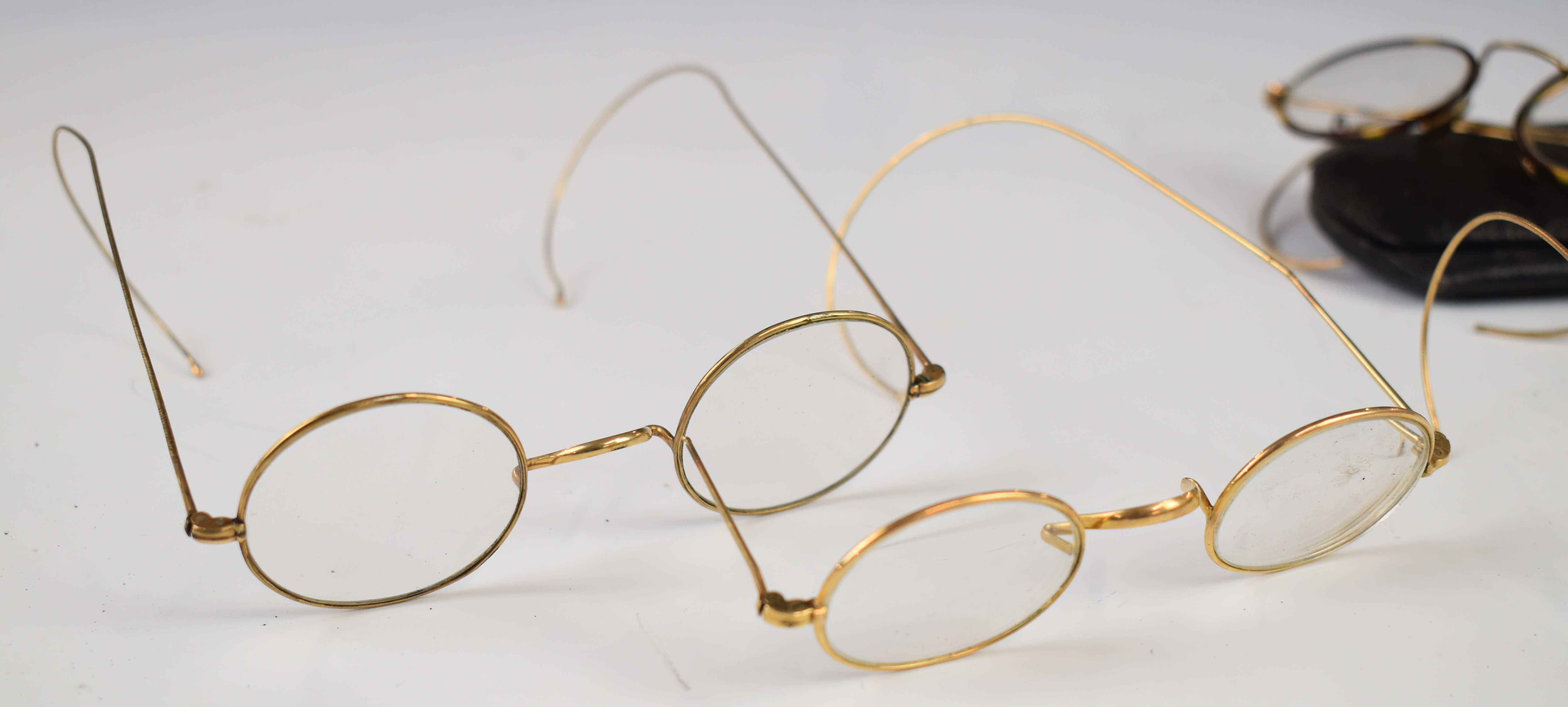 Four pairs of late 19th/ early 20thC vintage gold spectacles together with a Gloucester Co-Operative - Image 3 of 4
