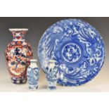 Japanese blue and white charger, an Imari vase and two Chinese vases, tallest 32cm