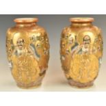 Pair of Japanese vases with figural decoration, height 23cm