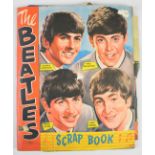 Beatles NEMS scrapbook with colour magazine poster pages and black and white clippings, contents