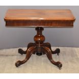 Victorian mahogany fold over card table raised on bulbous base and four scrolling legs, W90 x D45