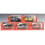 Five Carrera Evolution Ferrari model slot racing cars, all in original boxes.