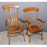 Two Windsor high backed elm seated armchairs