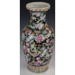 Chinese famille noir pedestal vase decorated with dragons amongst flowers, with seal mark to base,