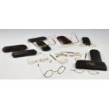 Eight pairs of late 19th or early 20thC vintage gold, tortoiseshell and similar spectacles, in cases