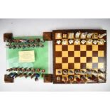 Two Brooks & Bentley chess sets with Egyptian and Roman figures, one with lead style pieces the