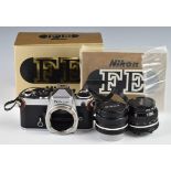 Nikon FE 35mm SLR camera with 28mm 1:2.8 and 50mm 1:2 lenses, together with original box and