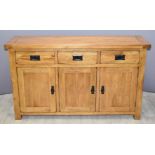 Contemporary solid oak sideboard with three drawers and cupboards, W139 x D42 x H83cm