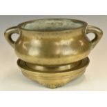 19thC Chinese bronze twin handled pedestal censer, with seal mark to base, on a stand with scrolling