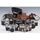 Five 35mm SLR and rangefinder cameras including Kiev 4 with 2/50 lens, Edixa flex with 1:2.8 50mm