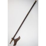 19th/20thC tribal axe, possibly Indian, with metal fittings, possibly once a pipe, length 91cm